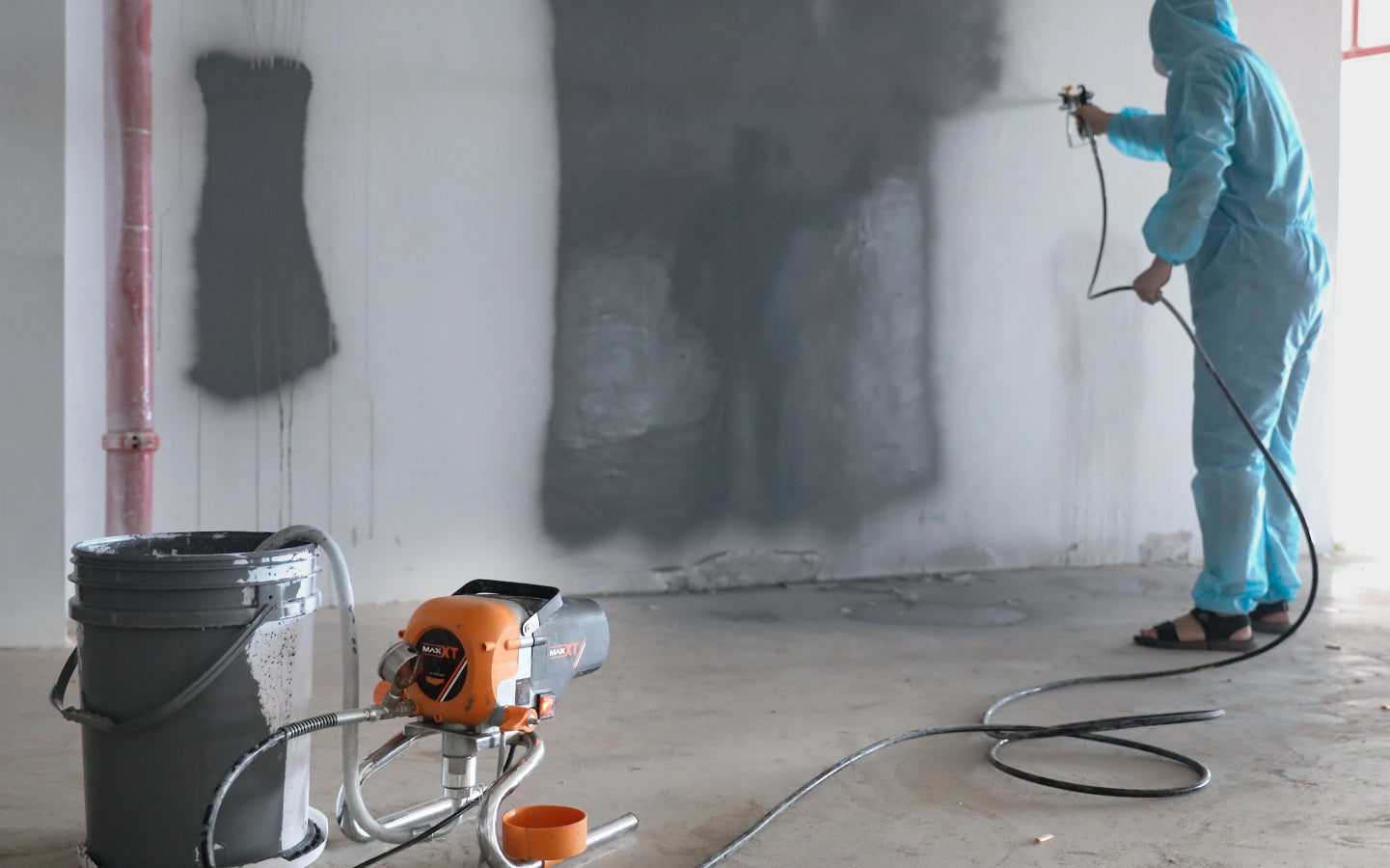 Professional comparing airless paint sprayer and traditional roller methods showing speed difference and finish quality on large wall surface