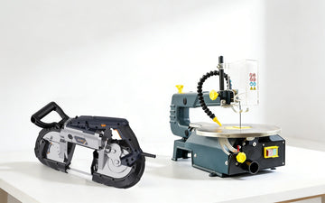 Scroll saw and band saw placed side by side on a clean workbench for direct comparison